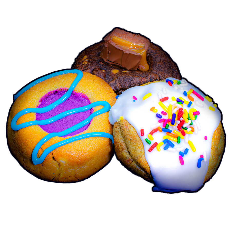 Three freshly baked cookies grouped together, including a s'mores Fatty, Fruity Pebbles Fatty, and Cookie Dough Bite Fatty 